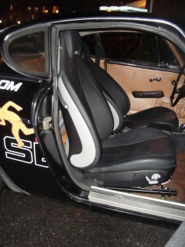 I installed new seats from a Mercedes SLK, which have a heated cushions and "airscarf,"  which blows warm air on your shoulders. Very spy!