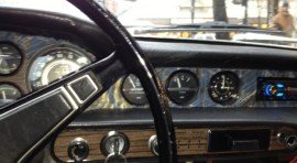 The 1972 woodgrain formica instrument panel troubled this ex-carpenter's sensibilities,  so covered it with hand made book paper.